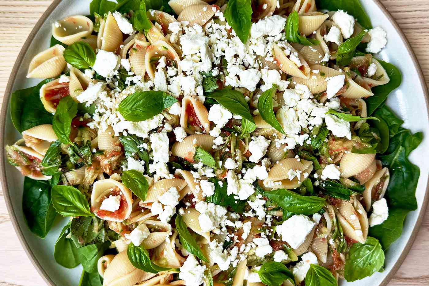 Pasta dish with vegetables and feta cheese