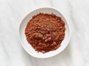 A bowl containing cocoa powder viewed from above