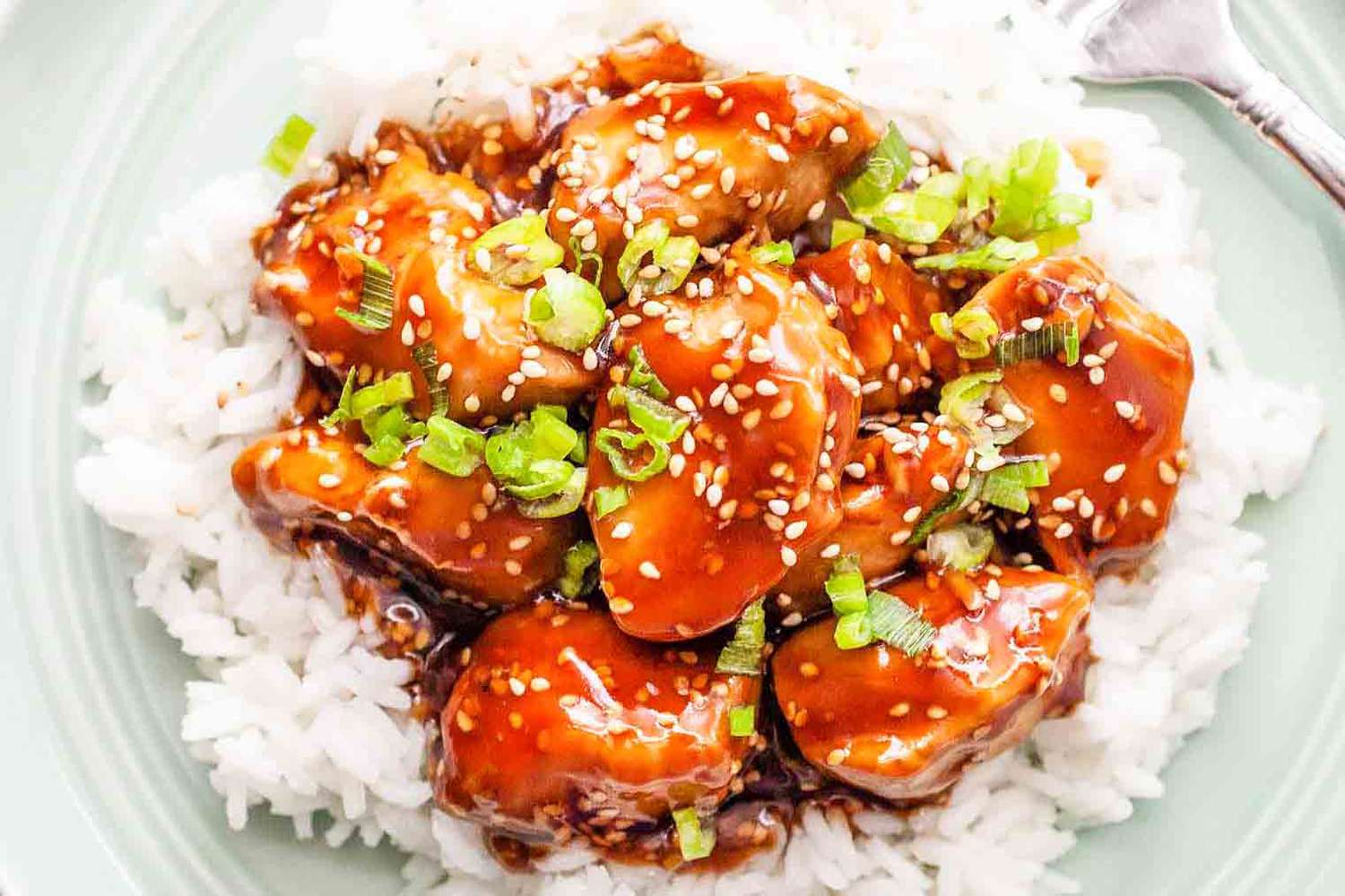 sesame chicken on top of rice