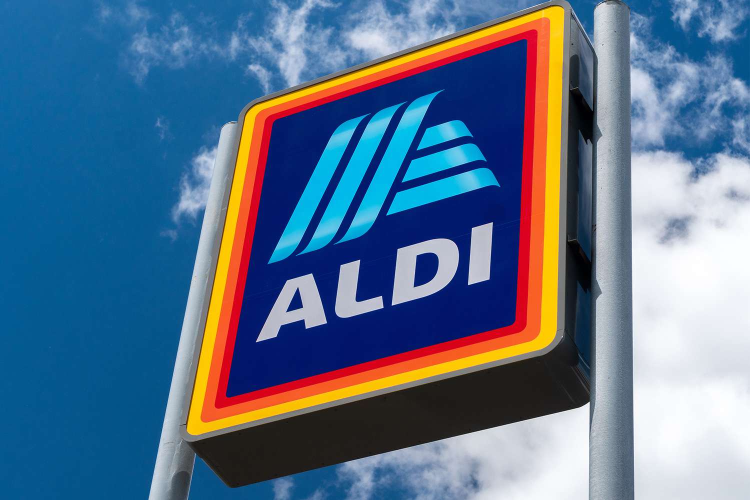 ALDI sign against a blue sky