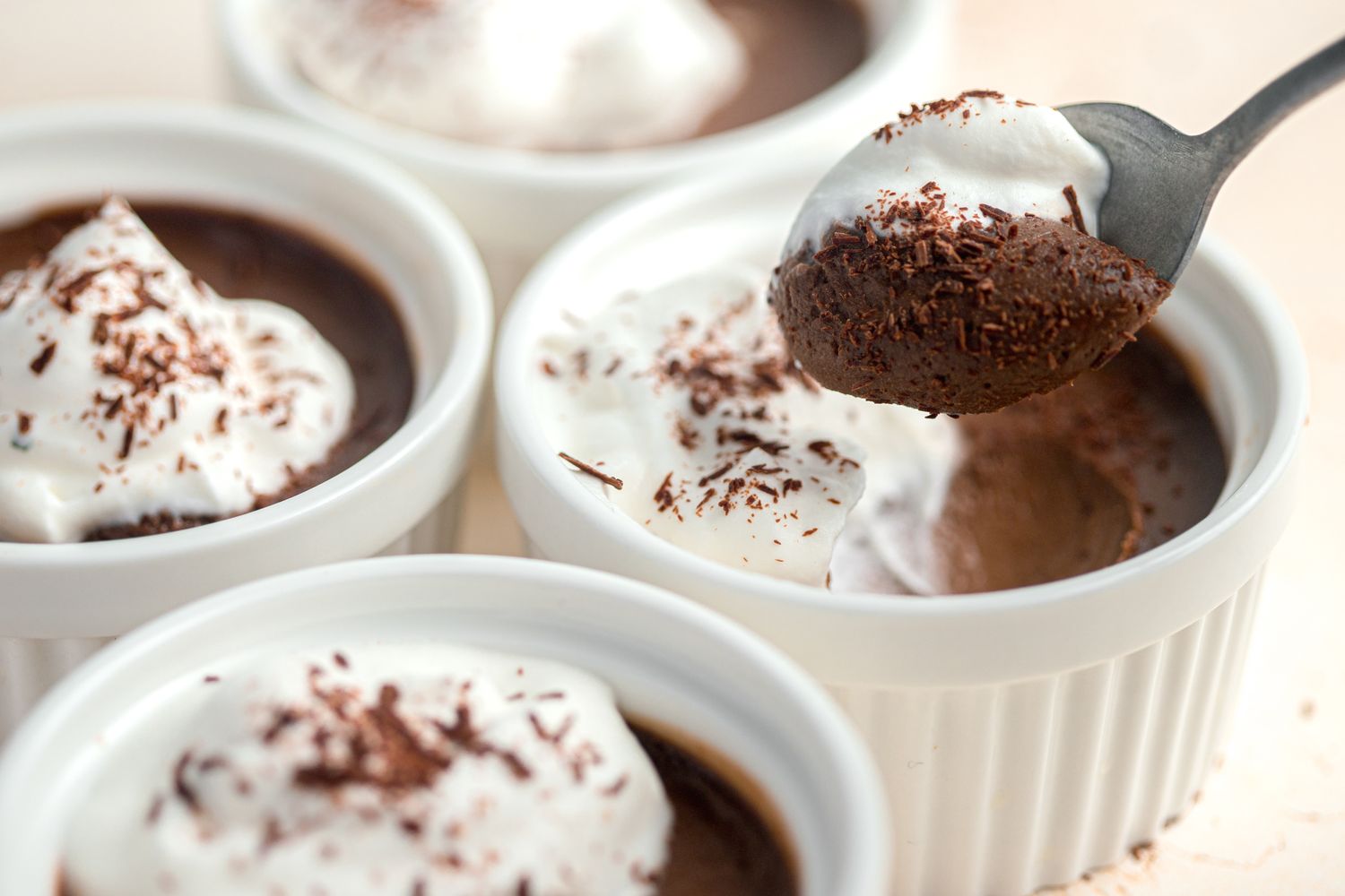 Chocolate Pots de Crème on a Spoon with More in Ramekins