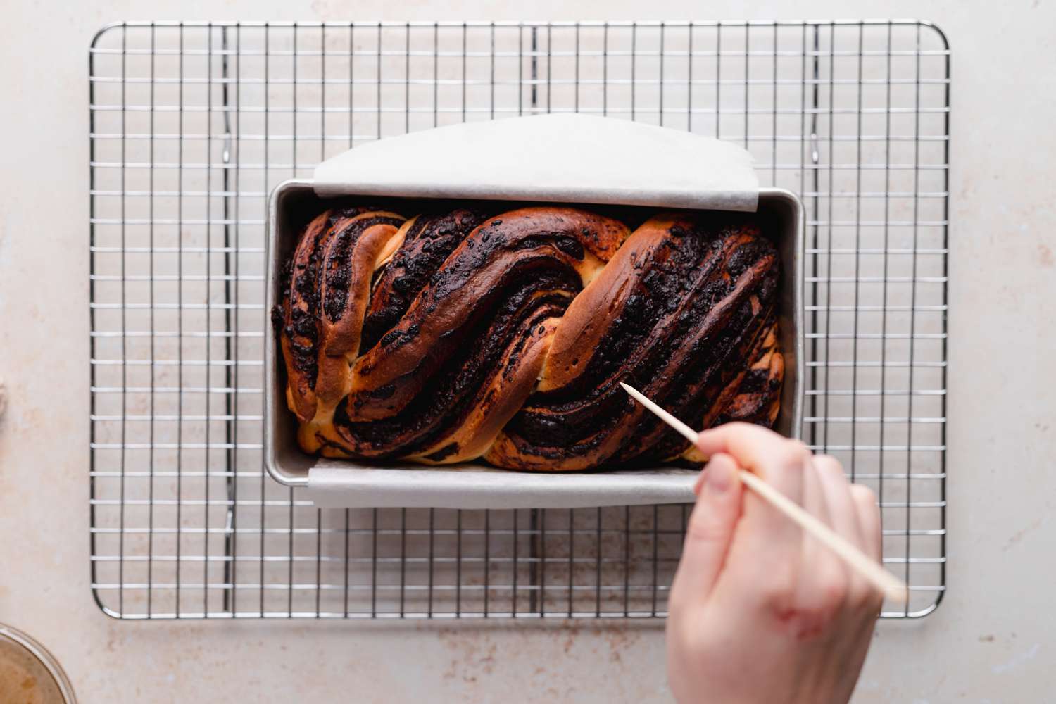 Testing chocolate babka for doneness.