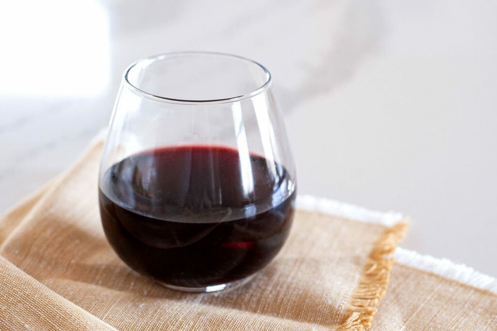 Glass of pinot noir to pair with salmon.