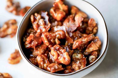 Candied walnuts in a white bowl