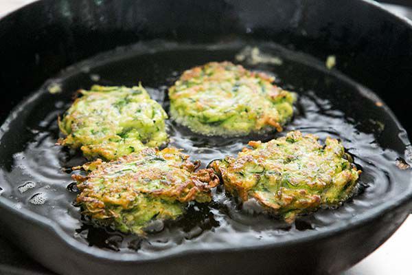 Zucchini fritters fry on the second side