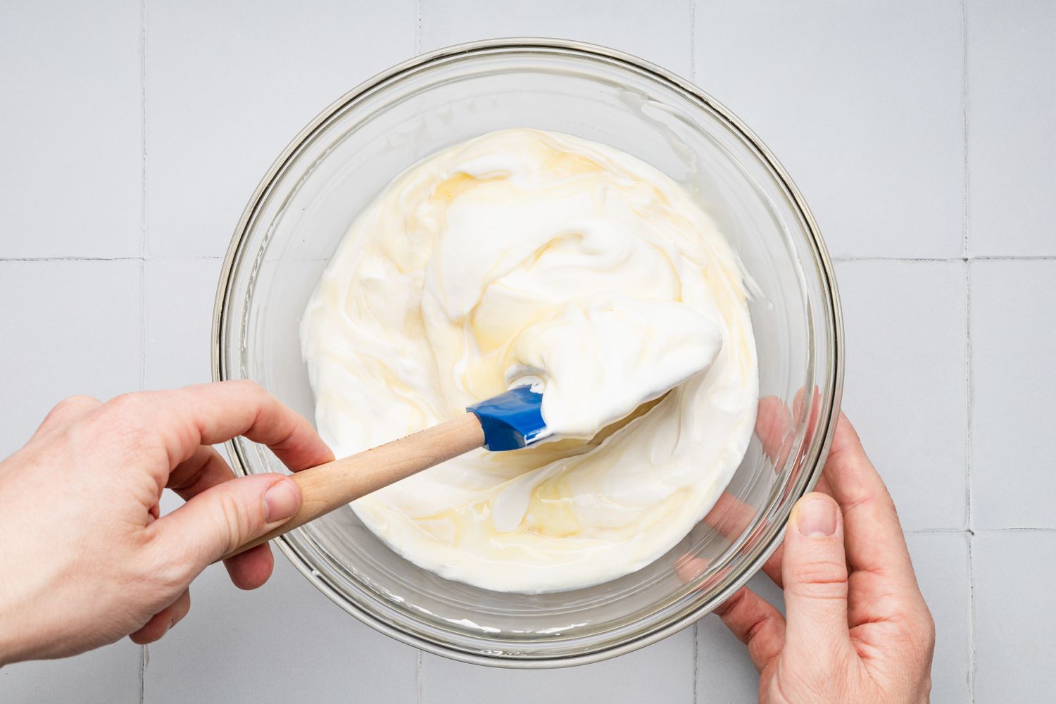 Whipped Cream Carefully Folded Into the No Churn Ice Cream Using a Plastic Spatula for Oreo Ice Cream Cake