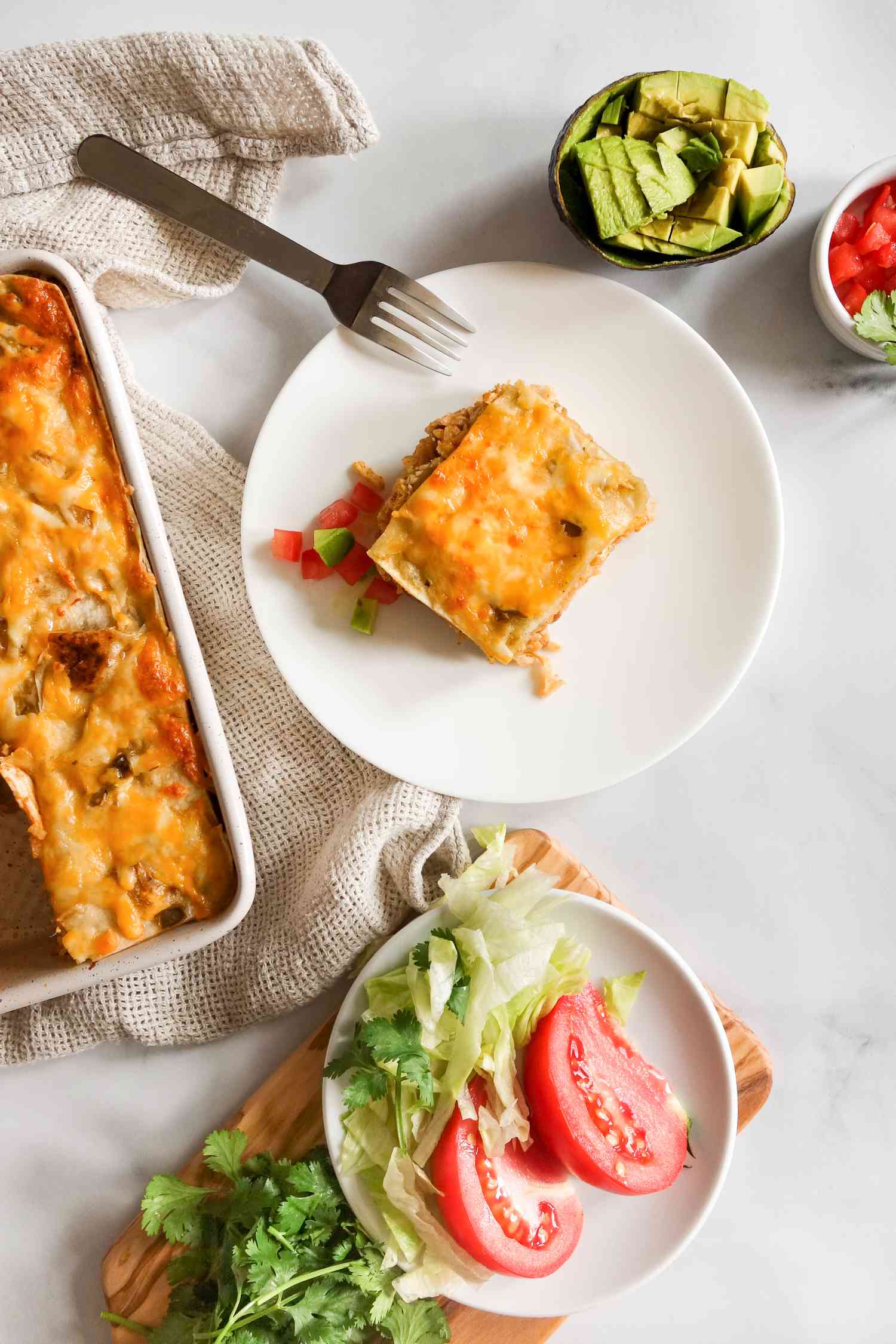 Slice of burrito casserole on plate.