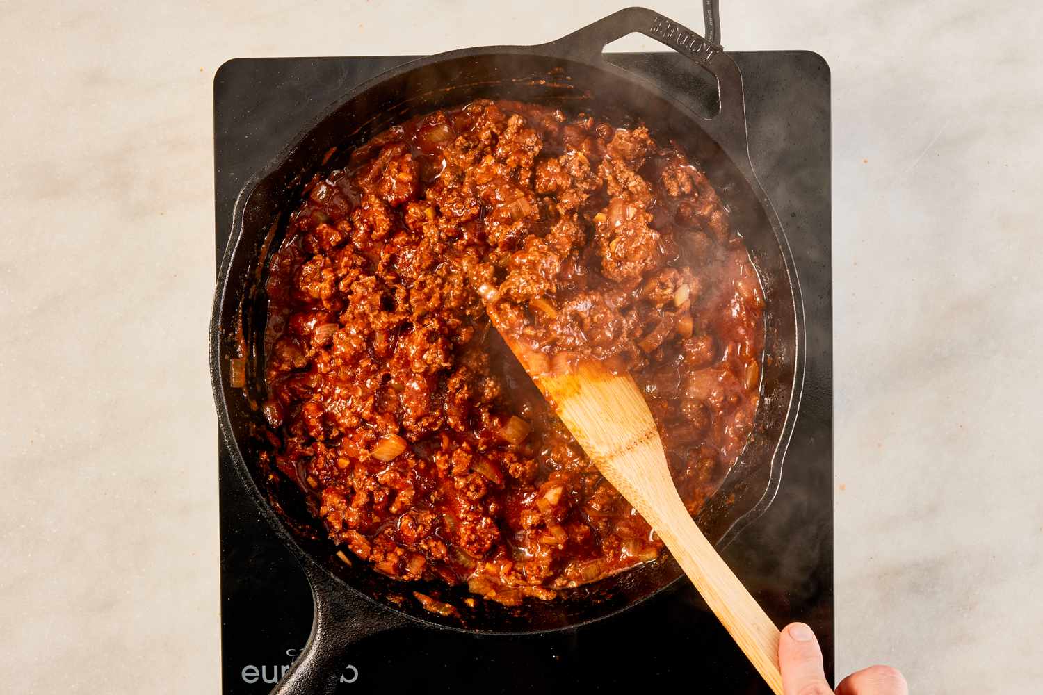 tomato sauce cooked down in the ground beef mixture for crispy ground beef recipe