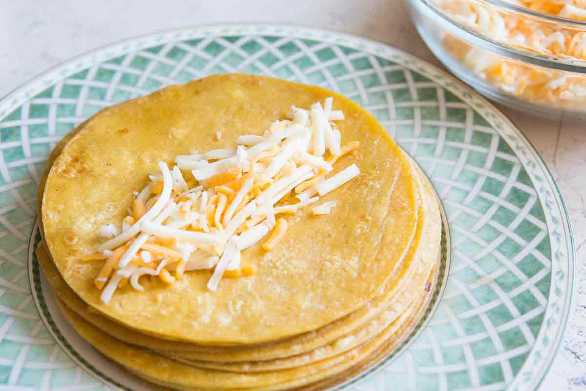 sprinkle inside of tortillas with cheese for enchiladas