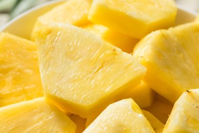 Sliced pineapple pieces arranged close together