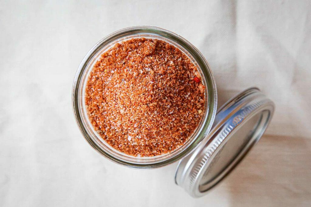 BBQ Spice Rub for Pulled Pork - overhead shot of red spice rub in jar