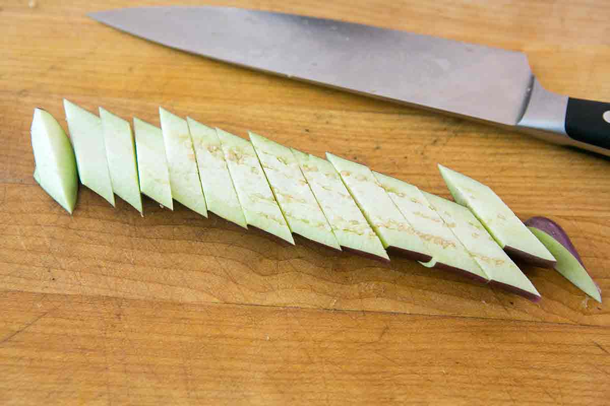 slice japanese eggplant to prepare for stir fry