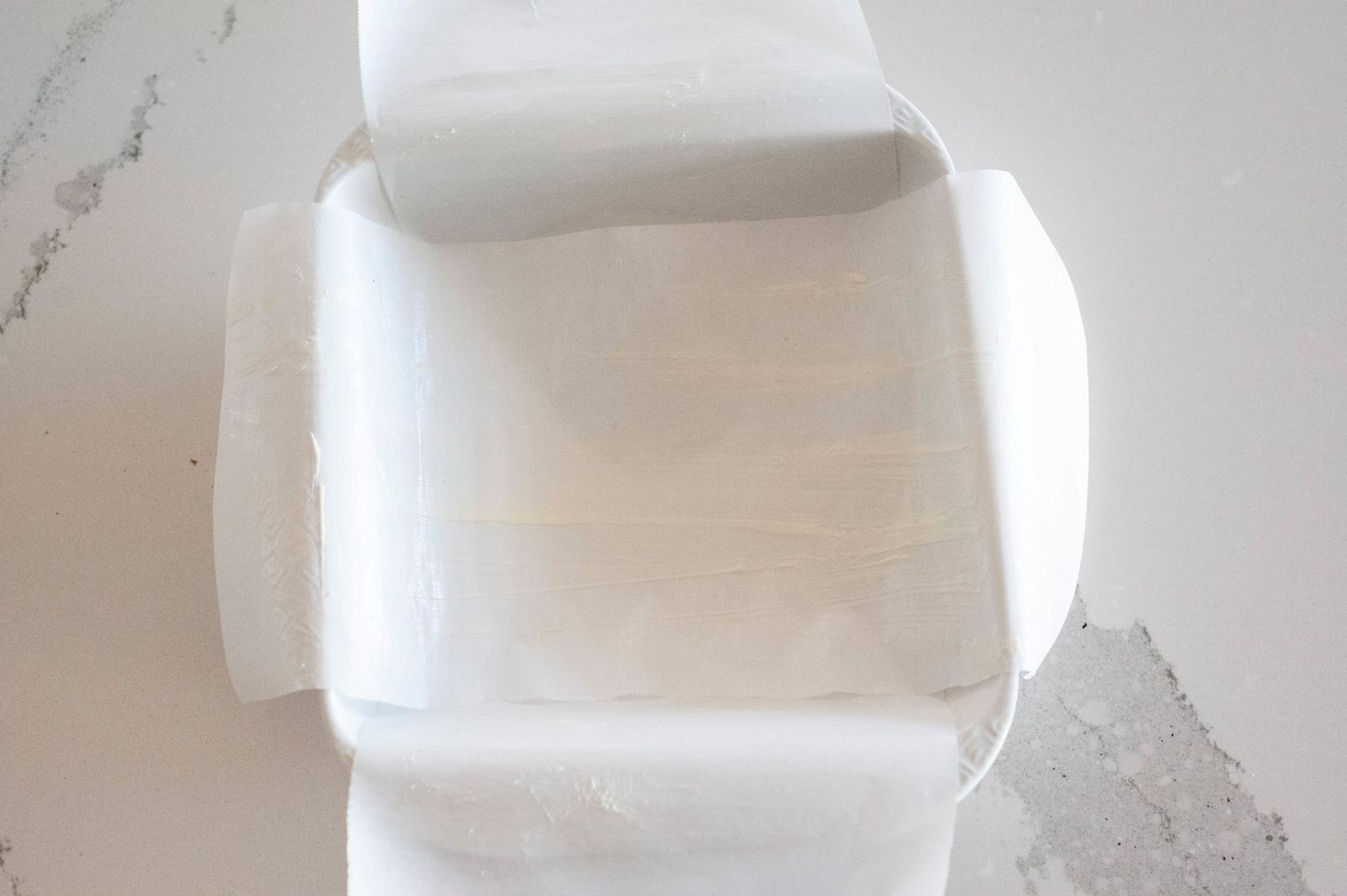 Parchment paper lined baking dish.