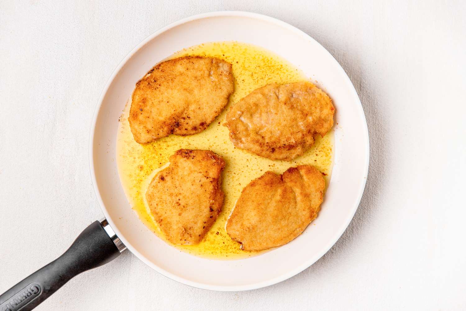 Italian butter chicken (petti di pollo al burro) in a skillet
