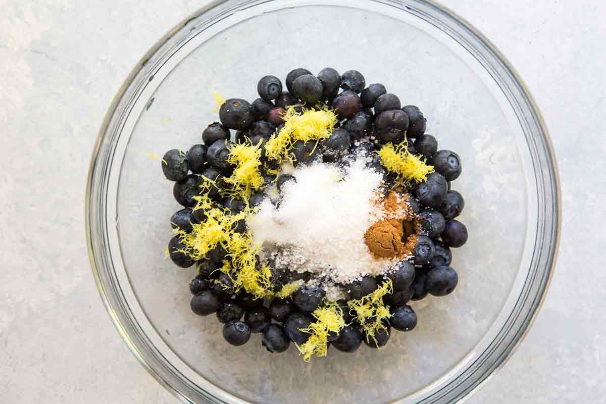 toss blueberries with sugar, lemon zest, cinnamon