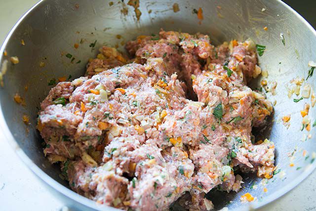 Mixing beef and Italian sausage for Homemade Meatloaf
