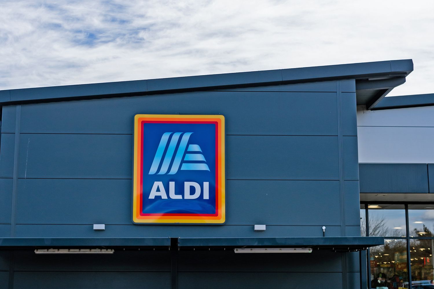 Aldi store exterior with logo showcasing the store sign on the building facade