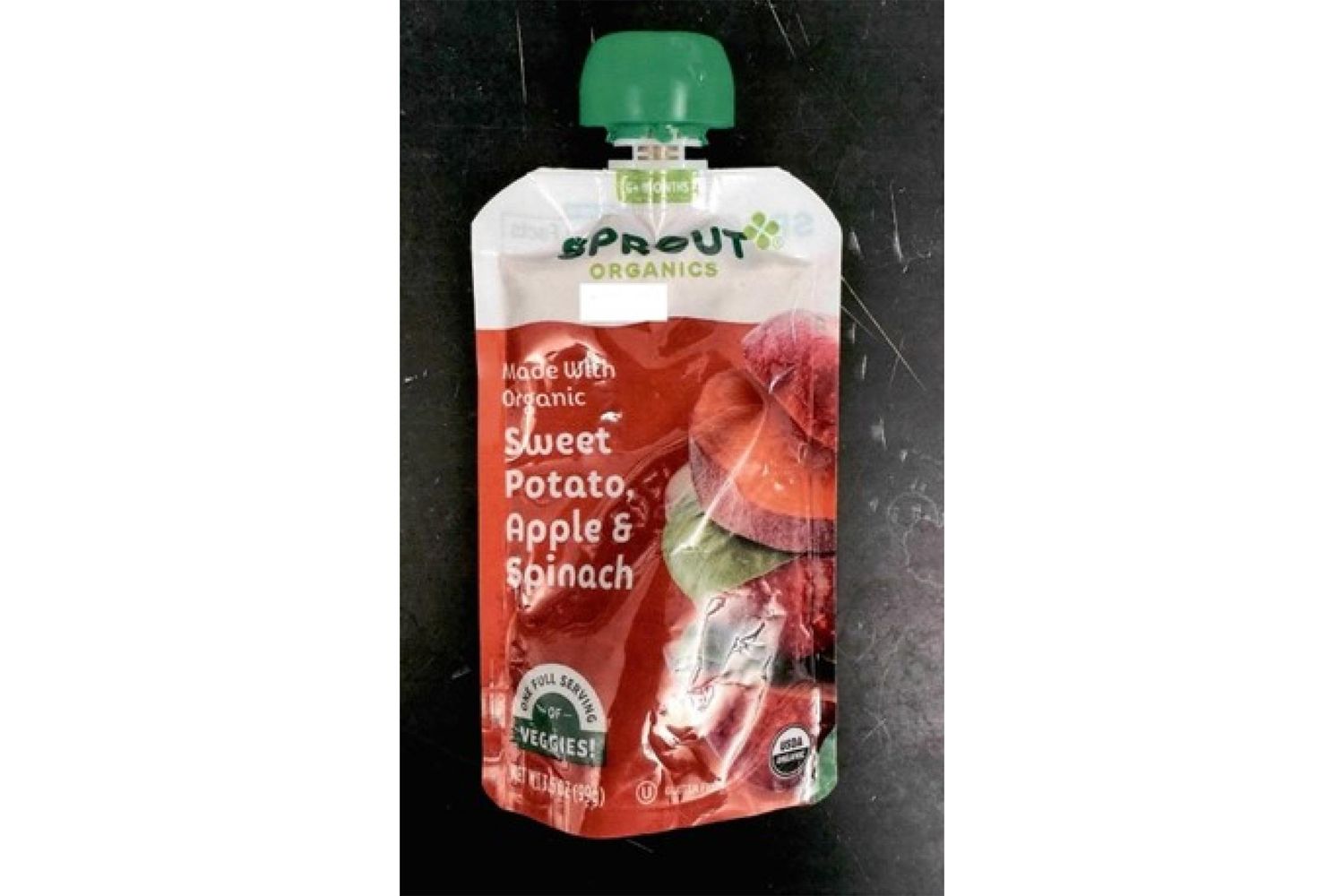 A pouch of Sprout Organic baby food with sweet potato apple and spinach