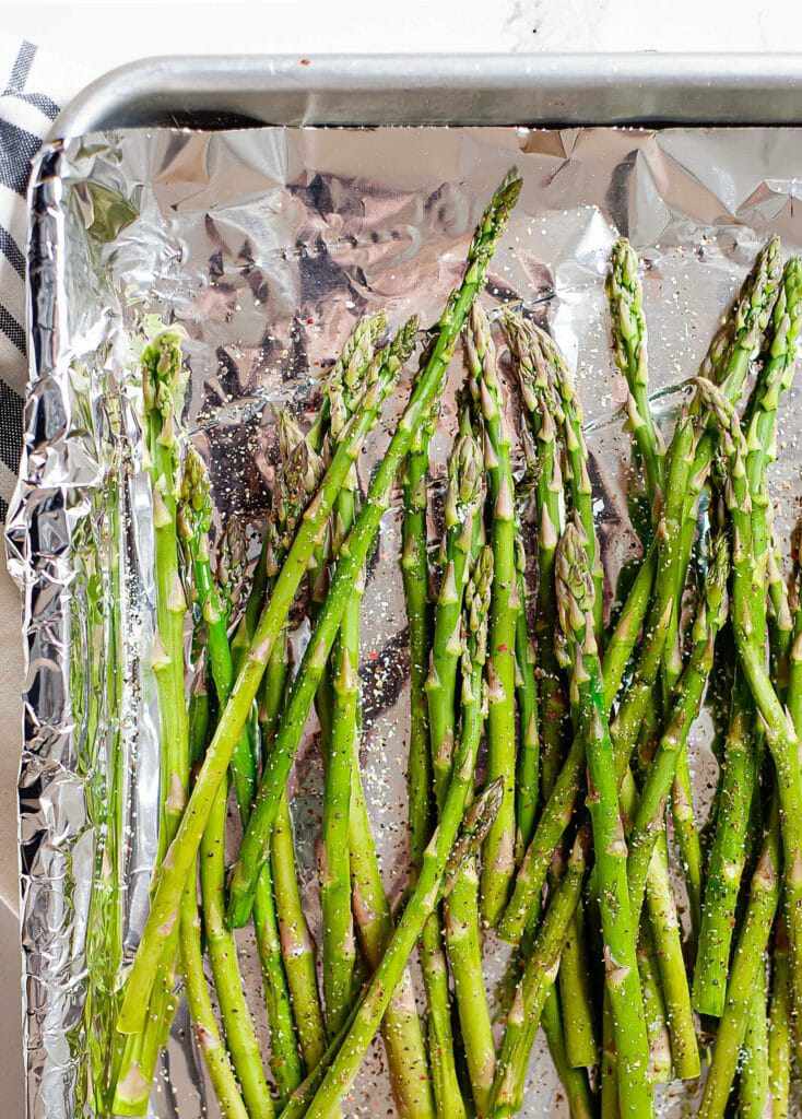 roasting asparagus on a baking sheet