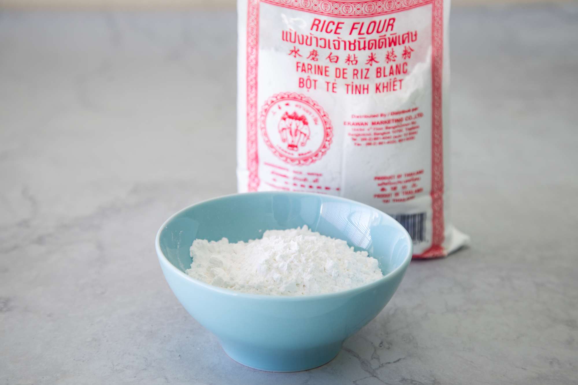 Rice flour in a bowl and bag