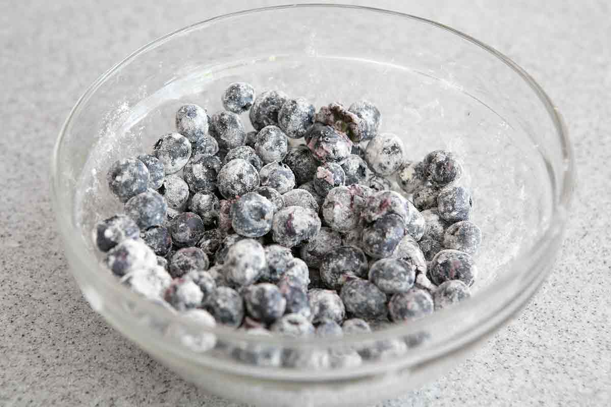 toss blueberries with flour so they don't sink when baking