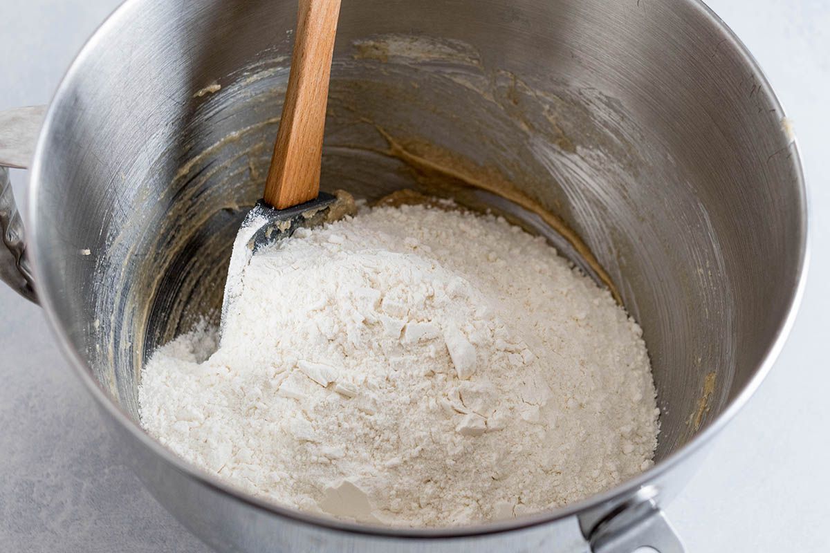Flour being mixed in easy chocolate chip cookie recipe.