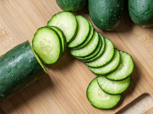 sliced cucumbers on a cutting board
