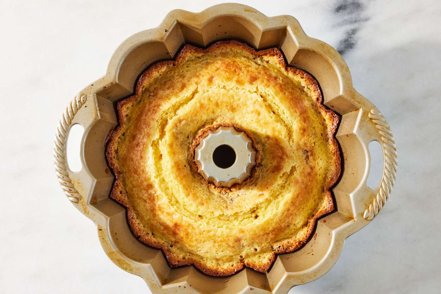 overhead view of baked cake in a bundt pan