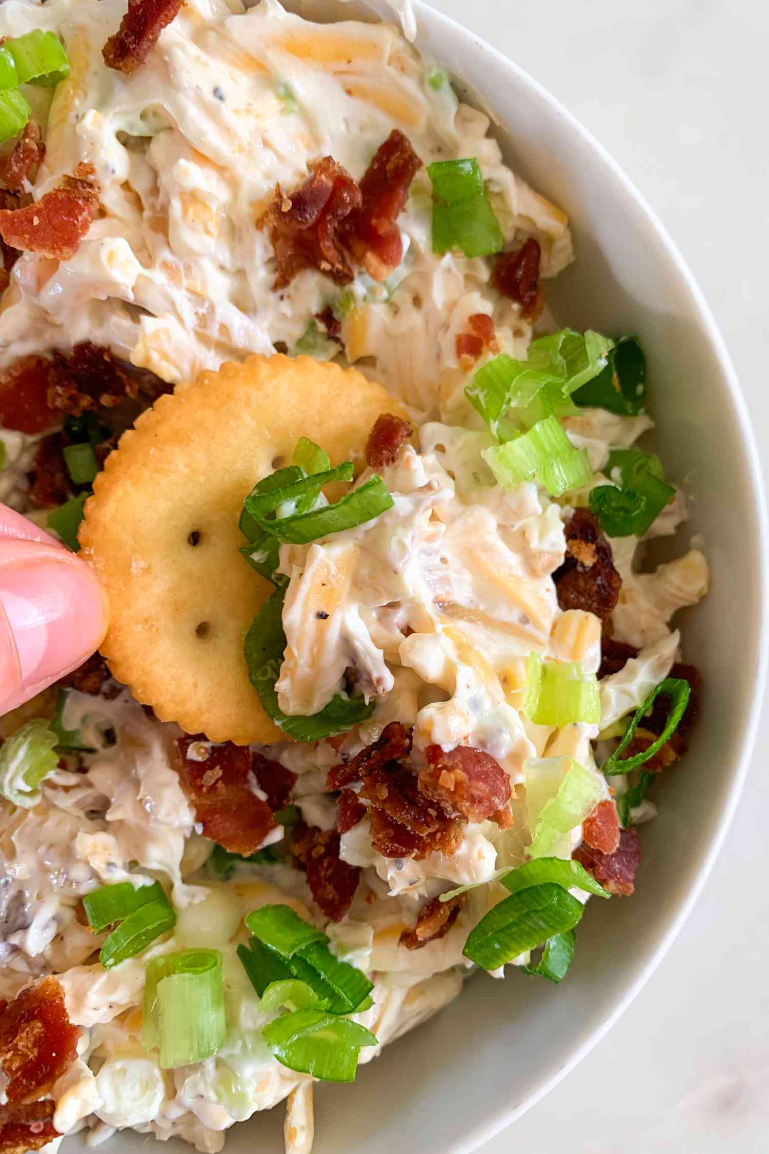 Ritz Cracker dipped into the Neiman Marcus dip