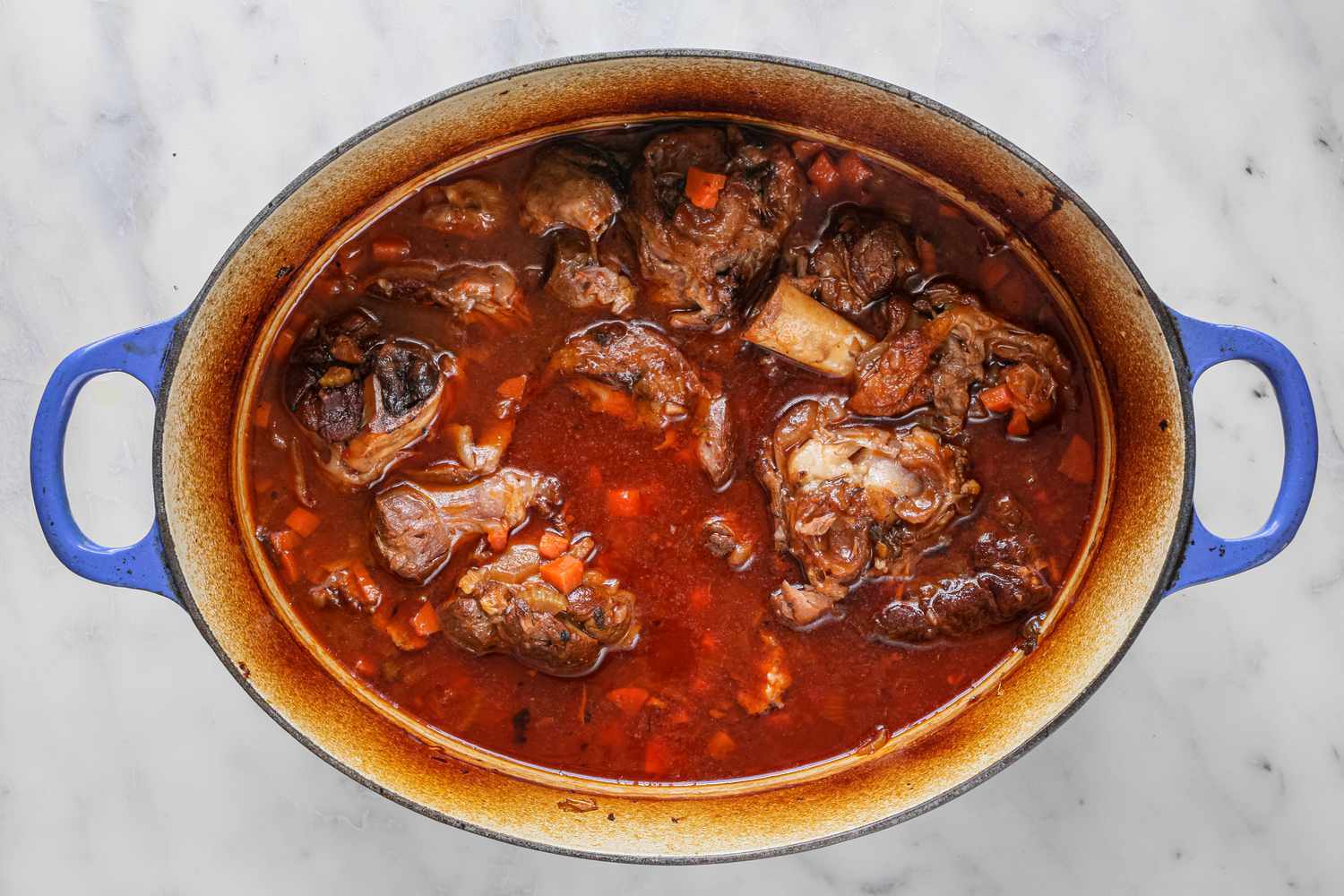 Stock Added to Dutch Oven for Lamb Shank Stew with Root Vegetables