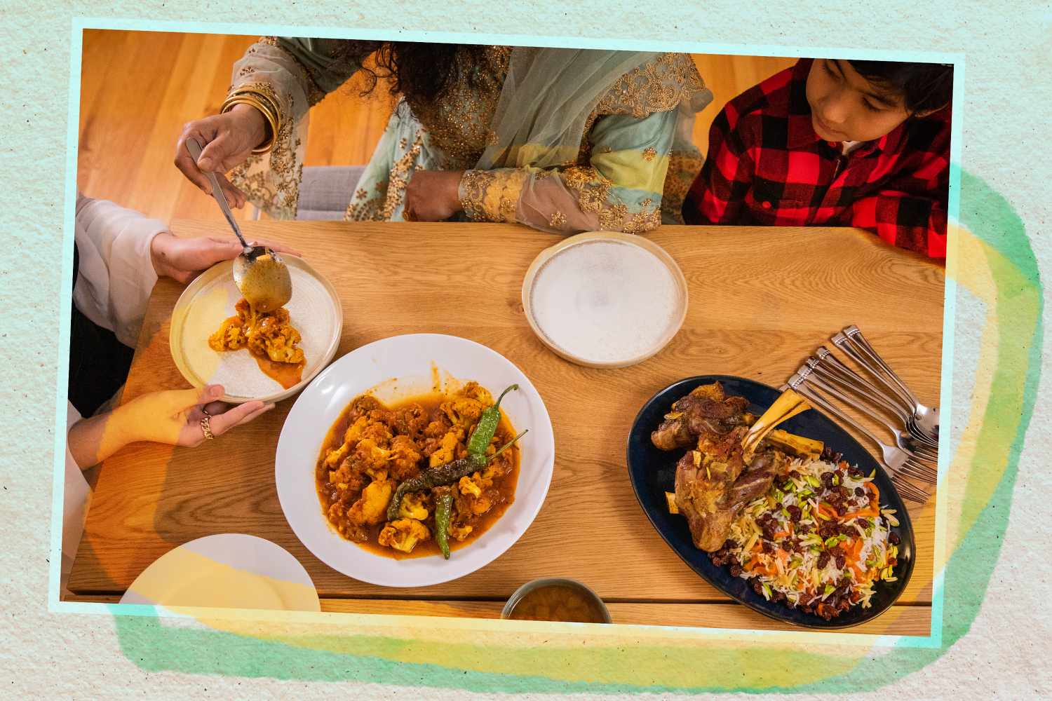People sitting around a table for Eid
