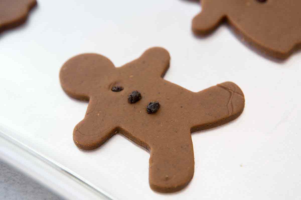 Close up on raw gingerbread man shape cookie dough