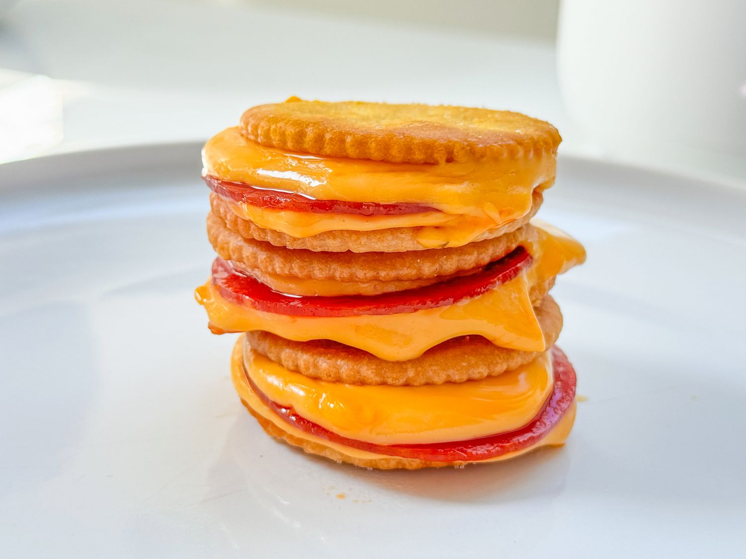 A stack of Ritz cracker pepperoni "pizzas"