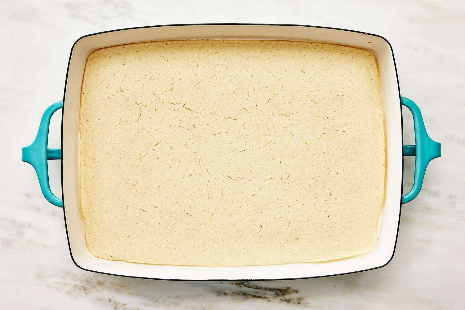 biscuit mix par-baked in the bottom of a casserole dish for Cattle Drive Casserole