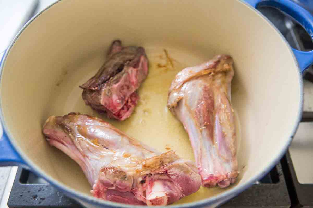 browning lamb pieces in pot