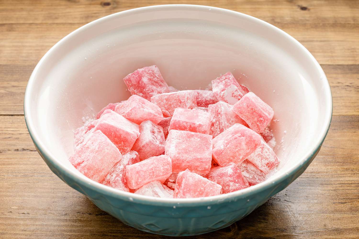 Turkish Delight Squares in the Bowl and Tossed With the Powder Mixture 
