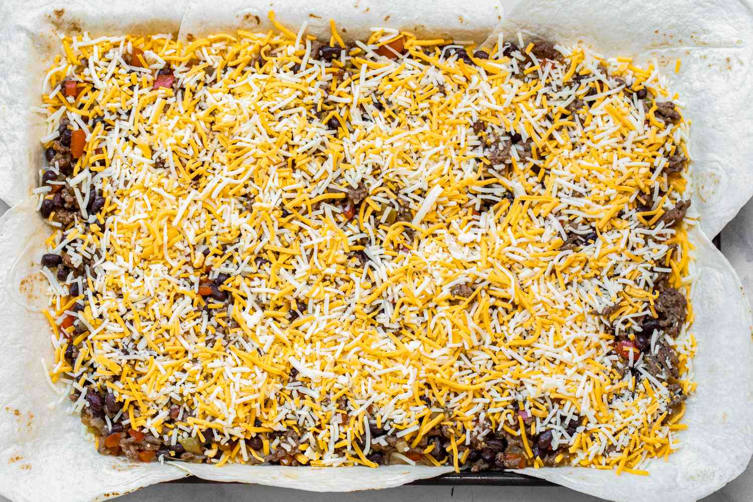 Another Layer of Cheese on Top of the Filling for Loaded Sheet Pan Quesadillas Recipe