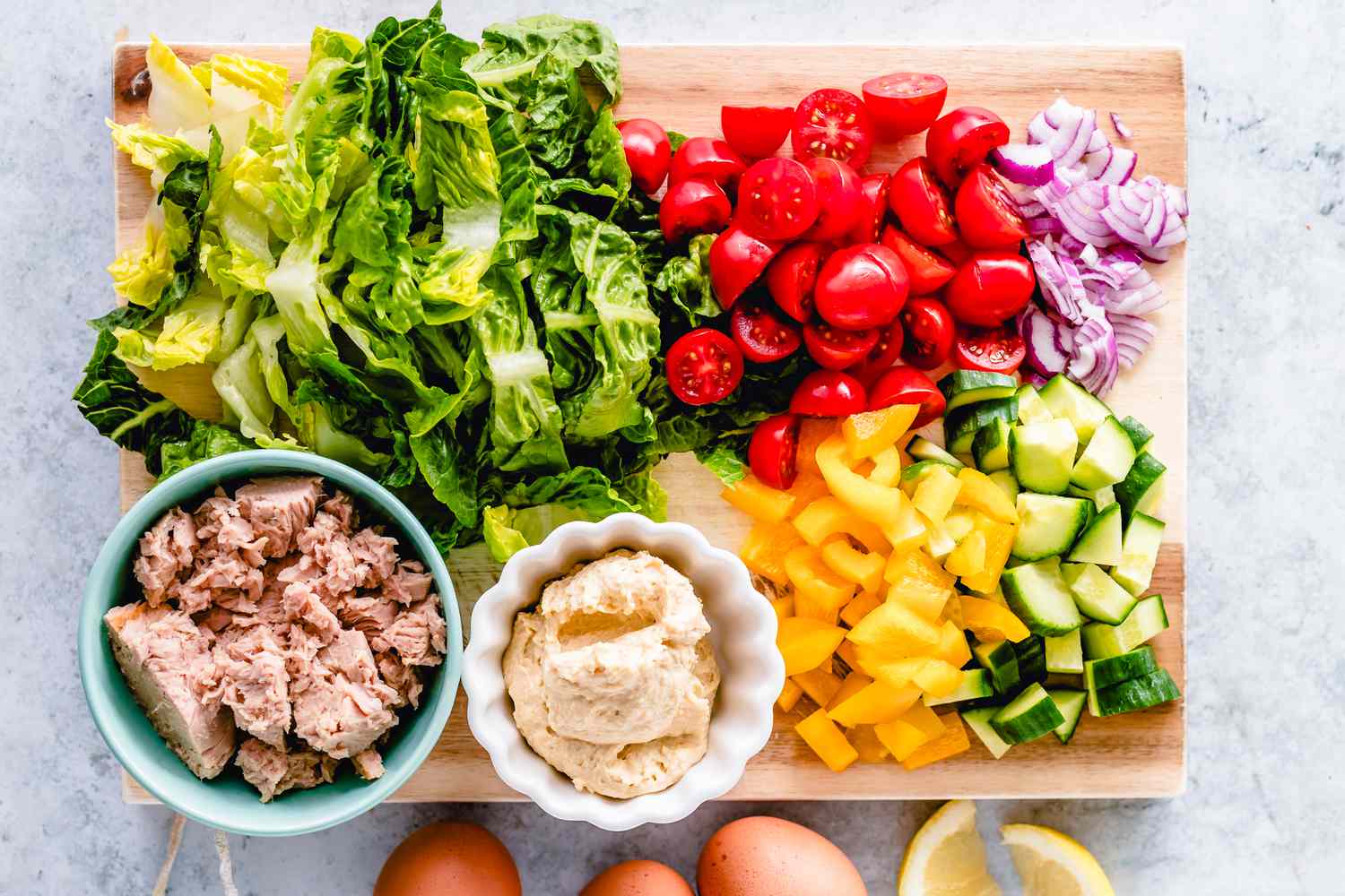 charcuterie board with a bowl of tuna 