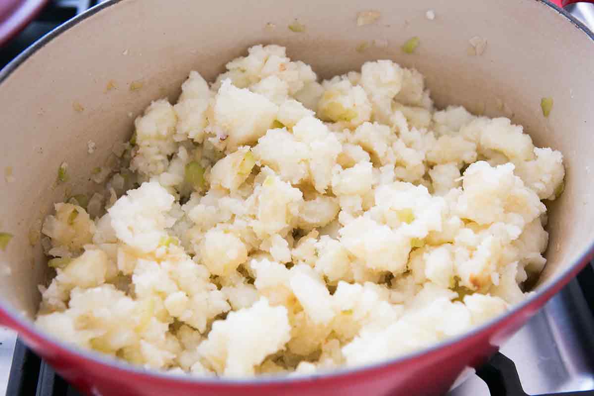 Mashing potatoes for loaded baked potato soup