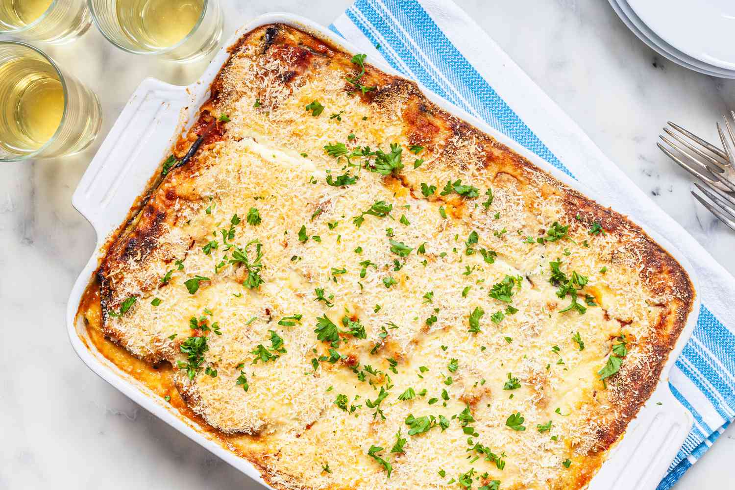 Eggplant and zucchini moussaka in casserole 