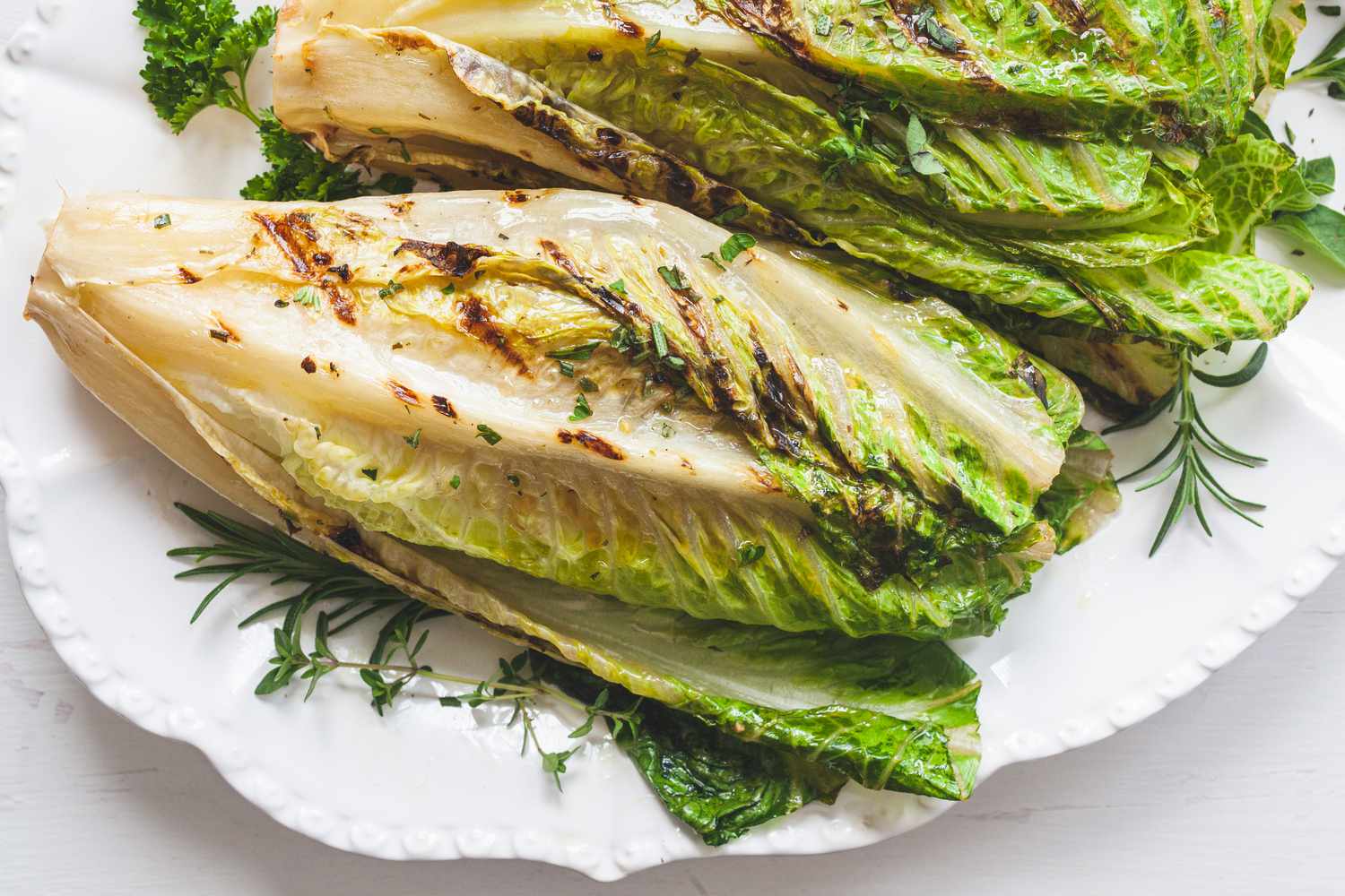 A platter of whole romaine in a romaine salad.