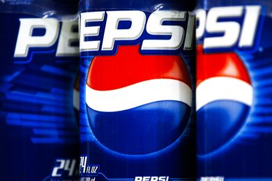 Pepsi soda cans with closeup view of branding and logo arranged side by side