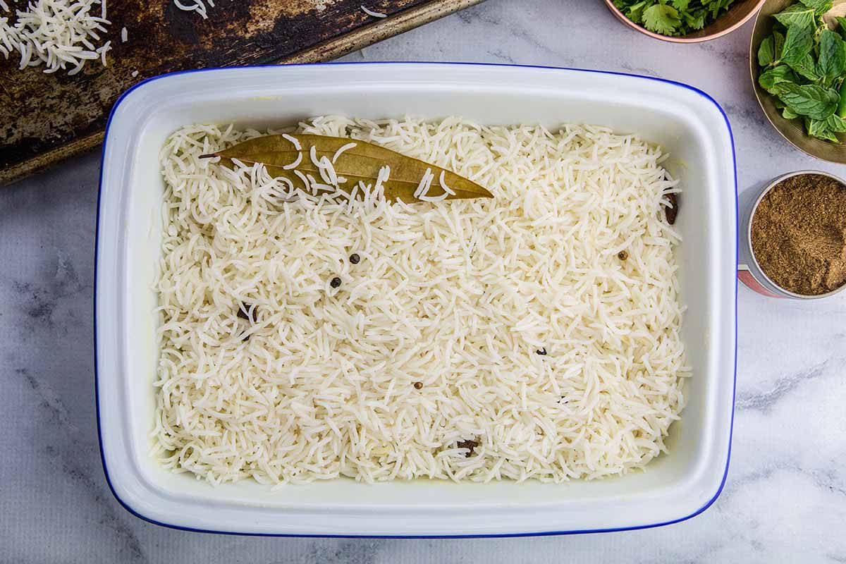 Indian Biryani with Chicken line the pan with rice