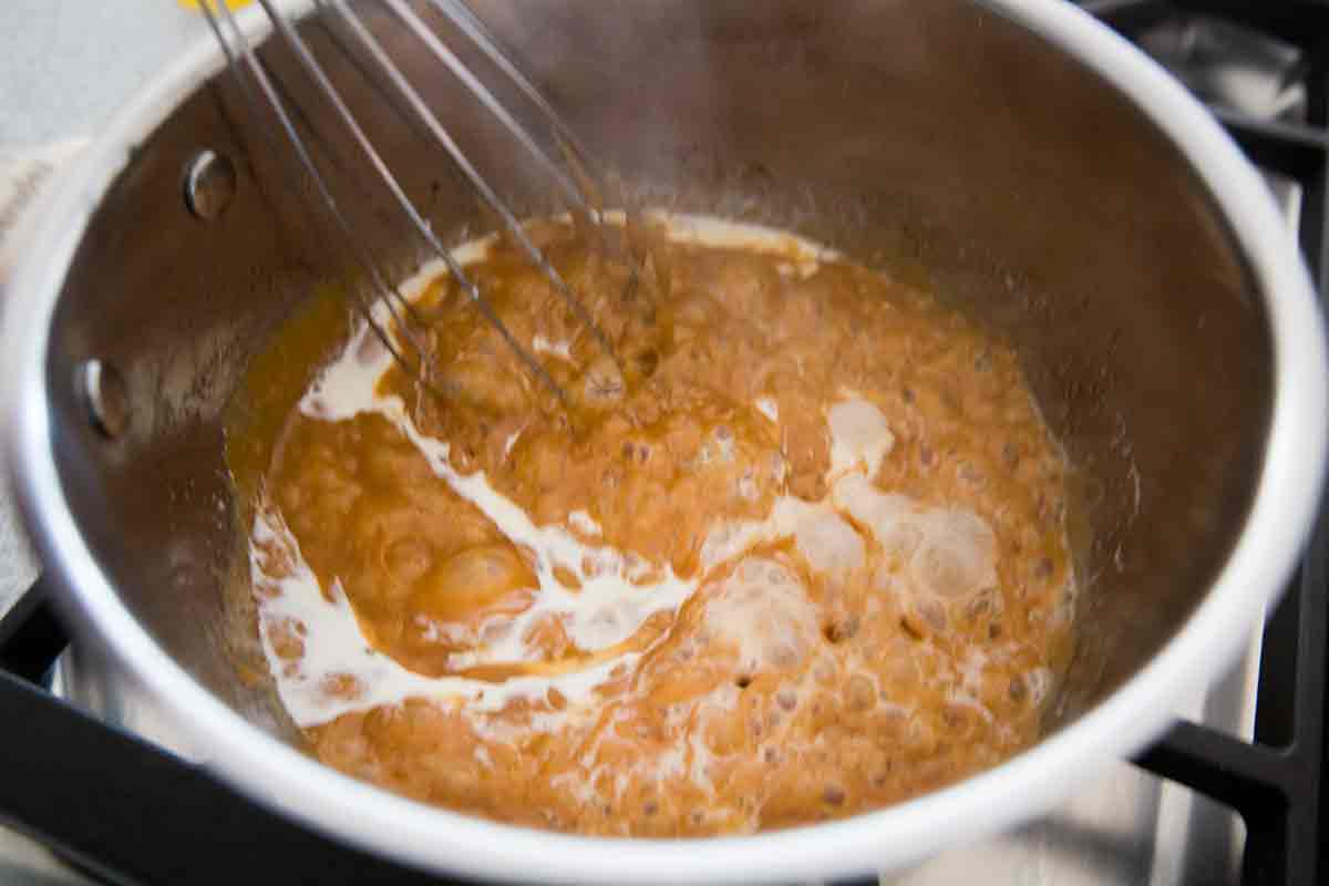 cream causes caramel sauce to bubble up in pan