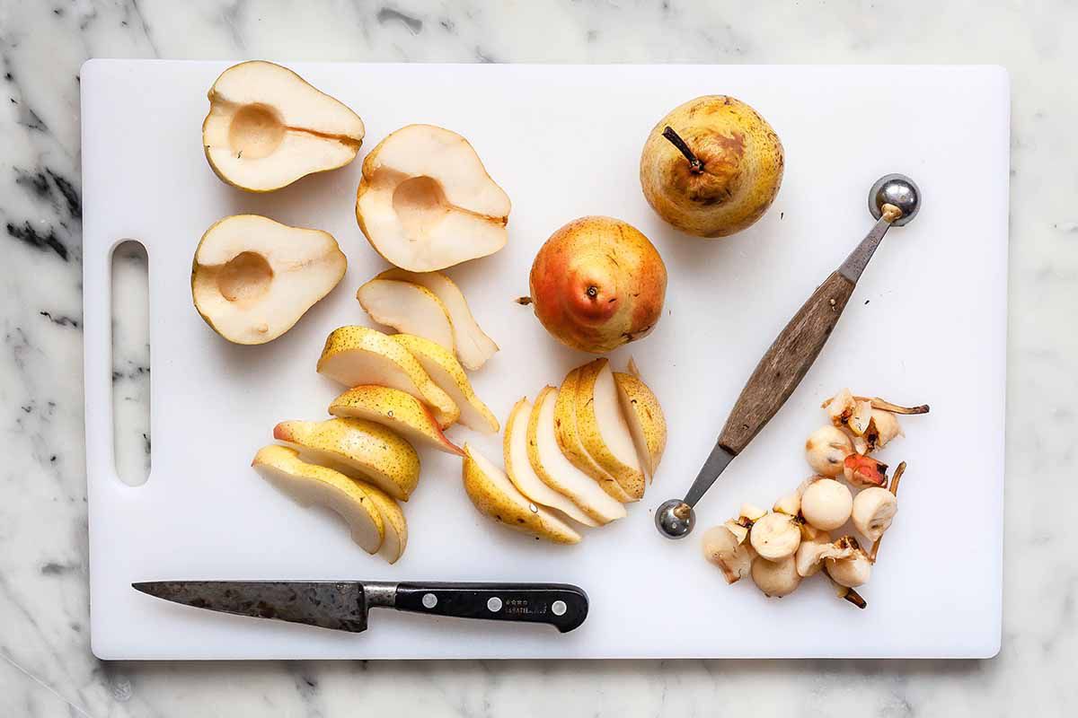 Sliced pears on a cutting board.