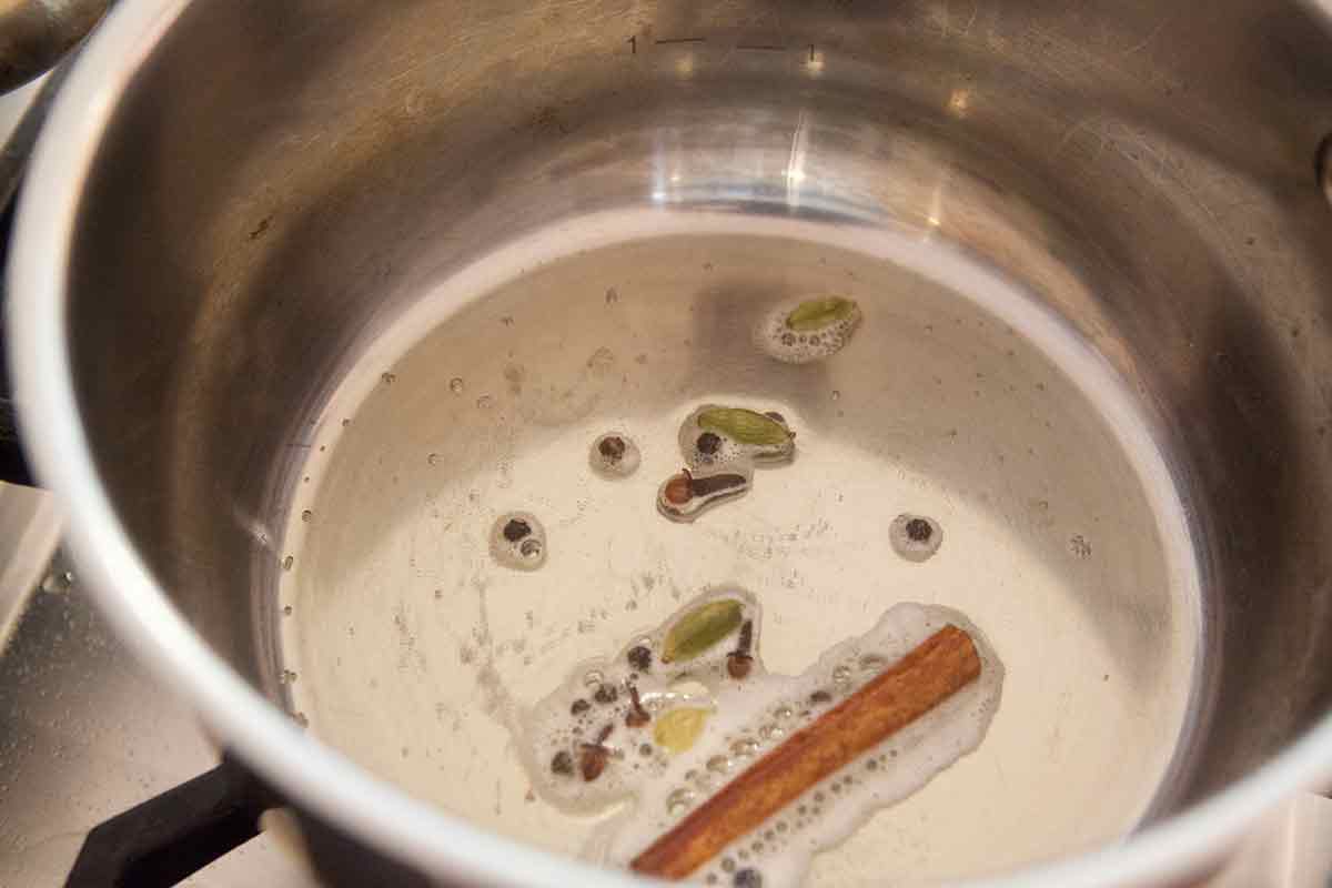 saffron rice spices being fried in pot