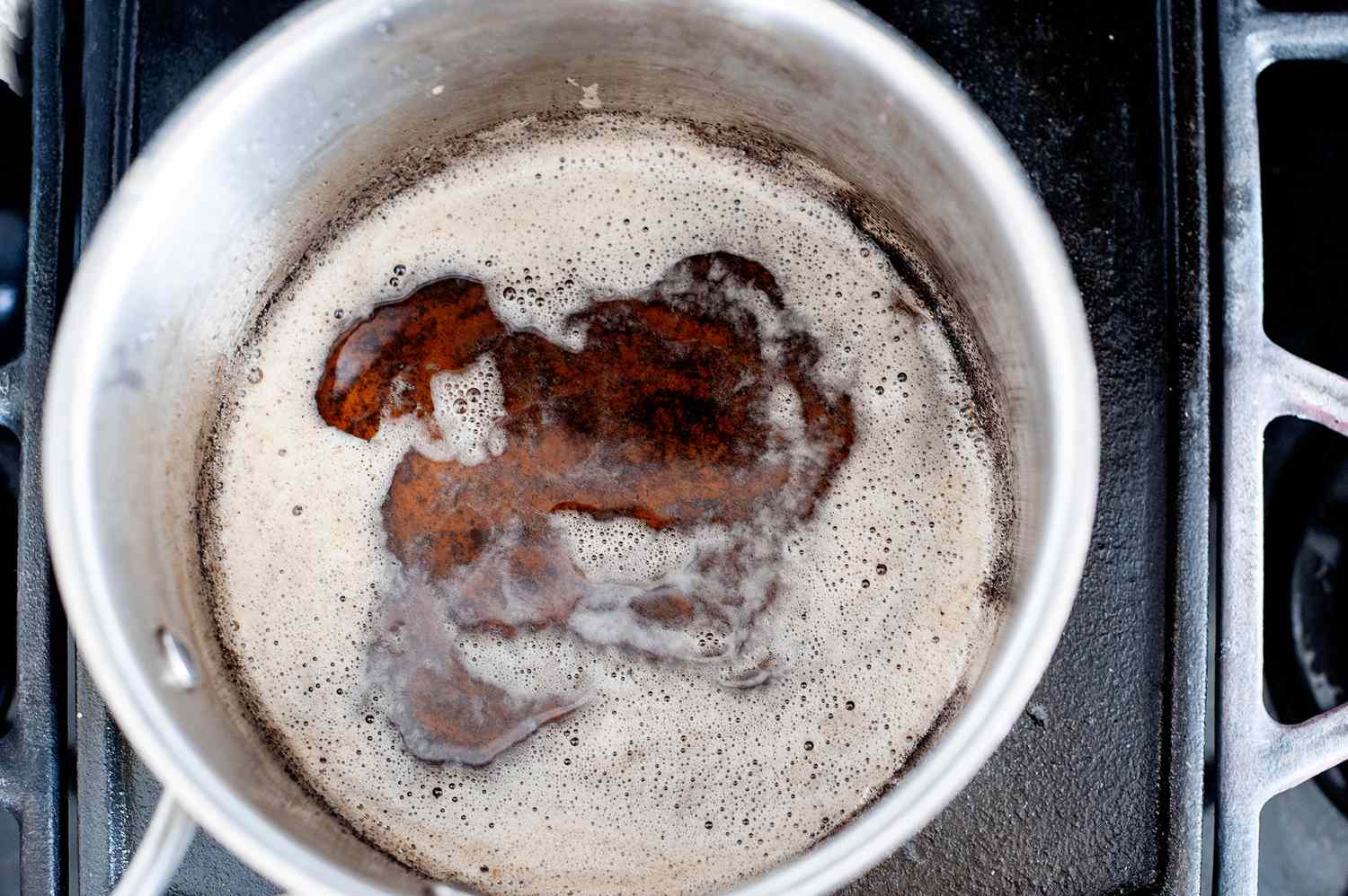 Making butter pecan ice cream recipe on the stove.