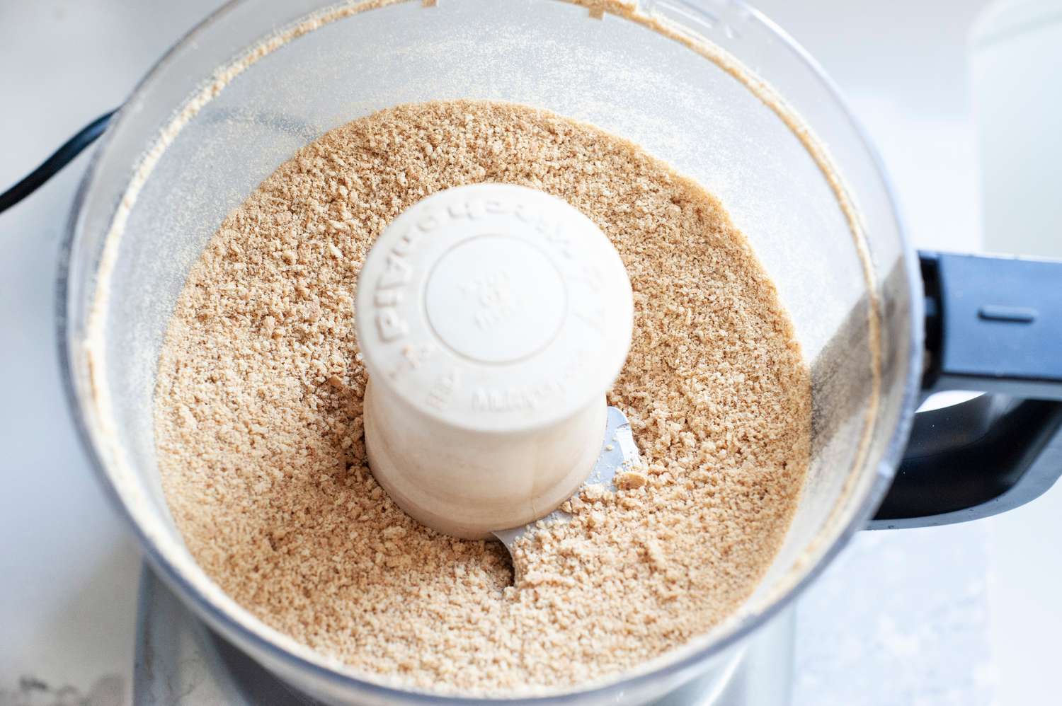 Process graham crackers in food processor. 