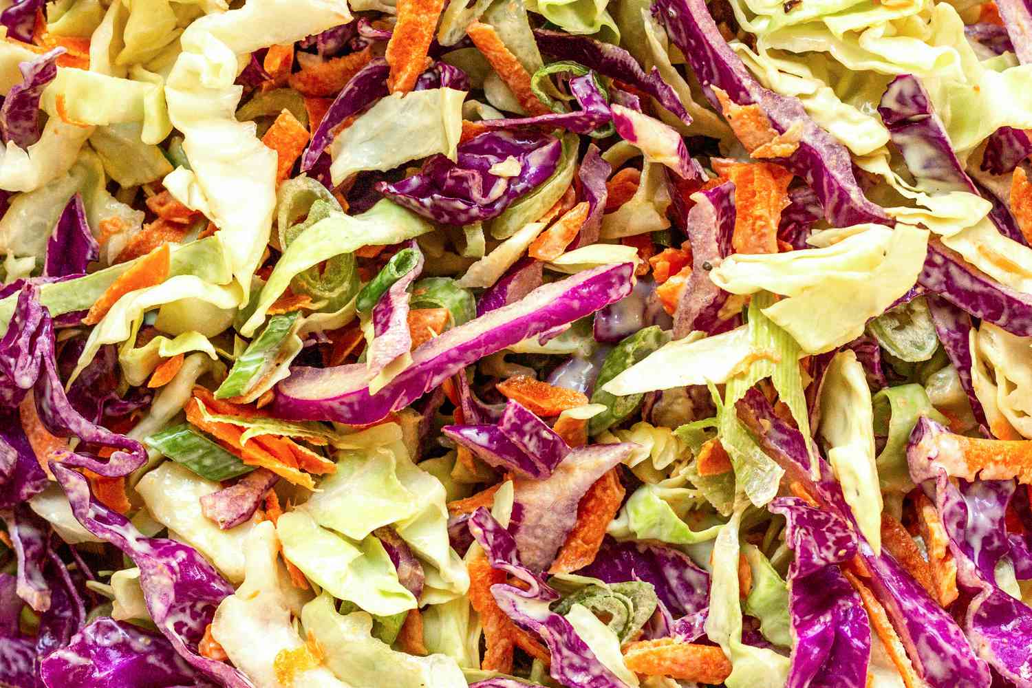Sliced cabbage and carrots mixed to make Classic Coleslaw.
