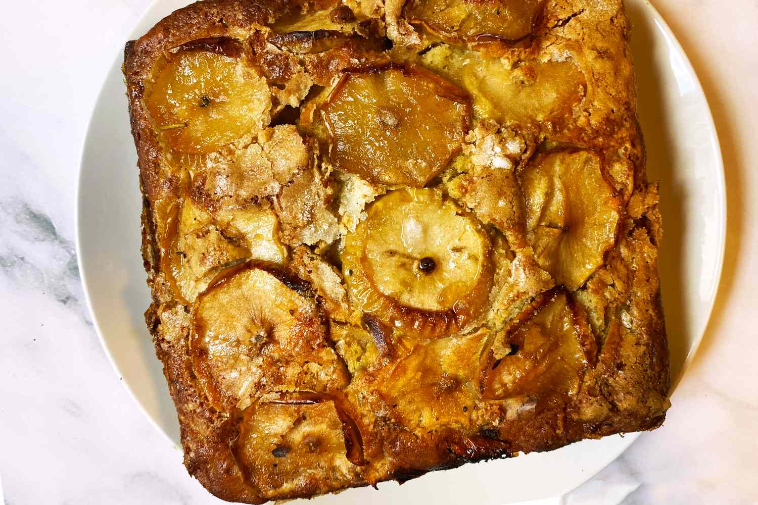 Apple cake on a white plate